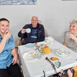 Enjoying cake at the MacMillan Coffee Morning - at Friary Care in Weymouth