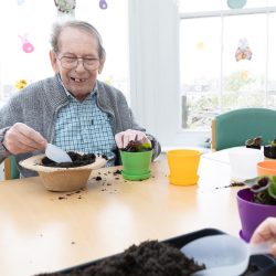 Potting plants for Easter at Friary Care 2025