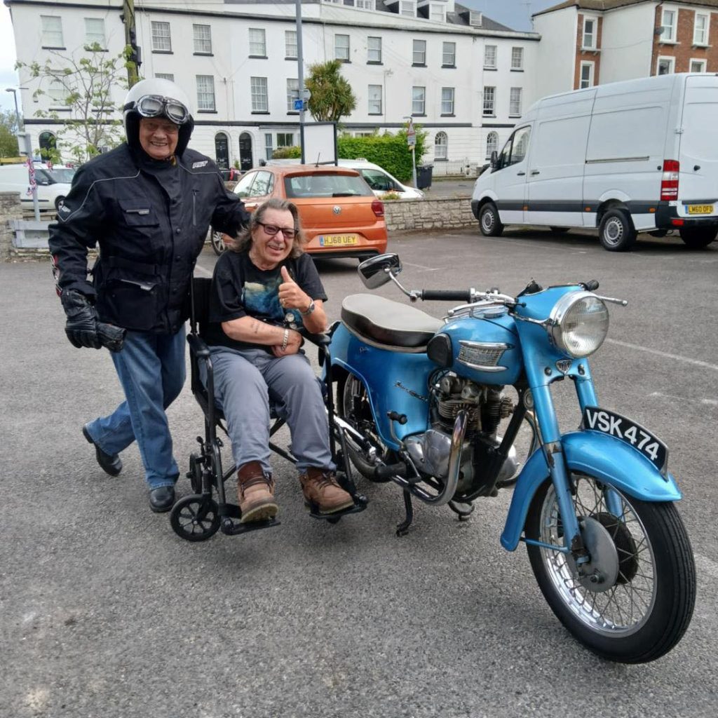 John brings his Triumph motorbike to visit Pat