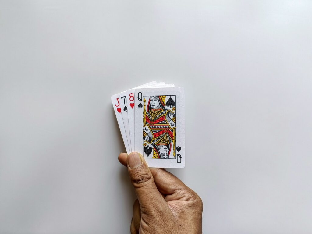 hand holding playing cards