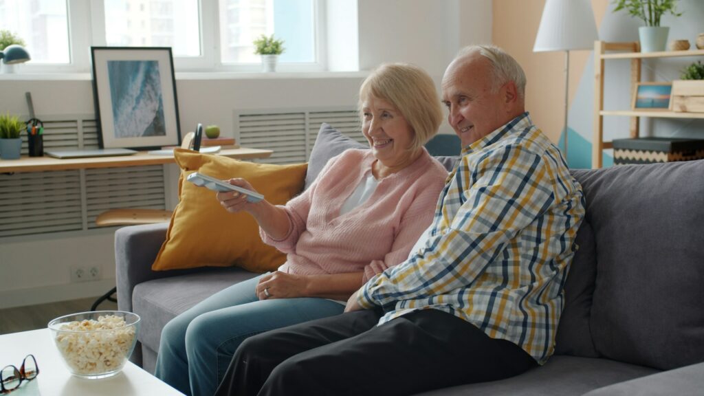 elderly couple watching tv