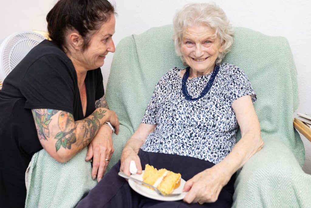 Enjoying cake at our Macmillan Coffee Morning
