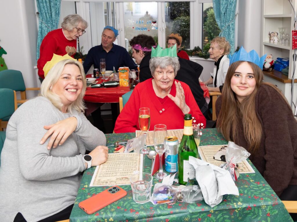 resident and family enjoying christmas dinner