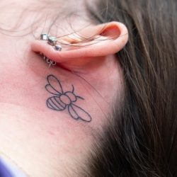 bee tatoo on friary care staff