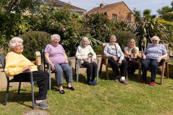 residents in the garden at friary care