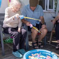 friary care residents playing a fishing game